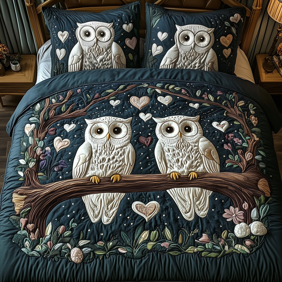 Owls quilted bedding set, quilt and two pillow shams on a made bed