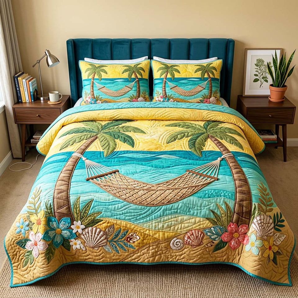 Palm Hammock Sunset quilted bedding set, quilt and two pillow shams on a made bed