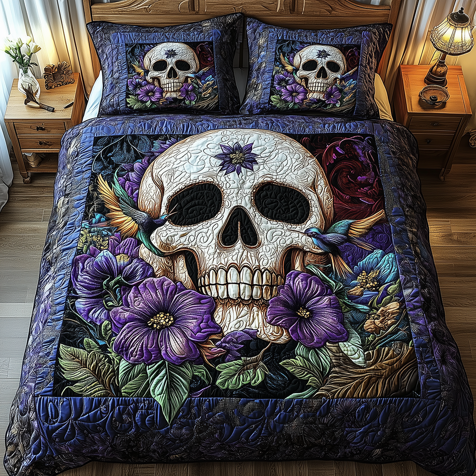 Pansy Skull Hummingbird Night quilted bedding set, quilt and two pillow shams on a made bed