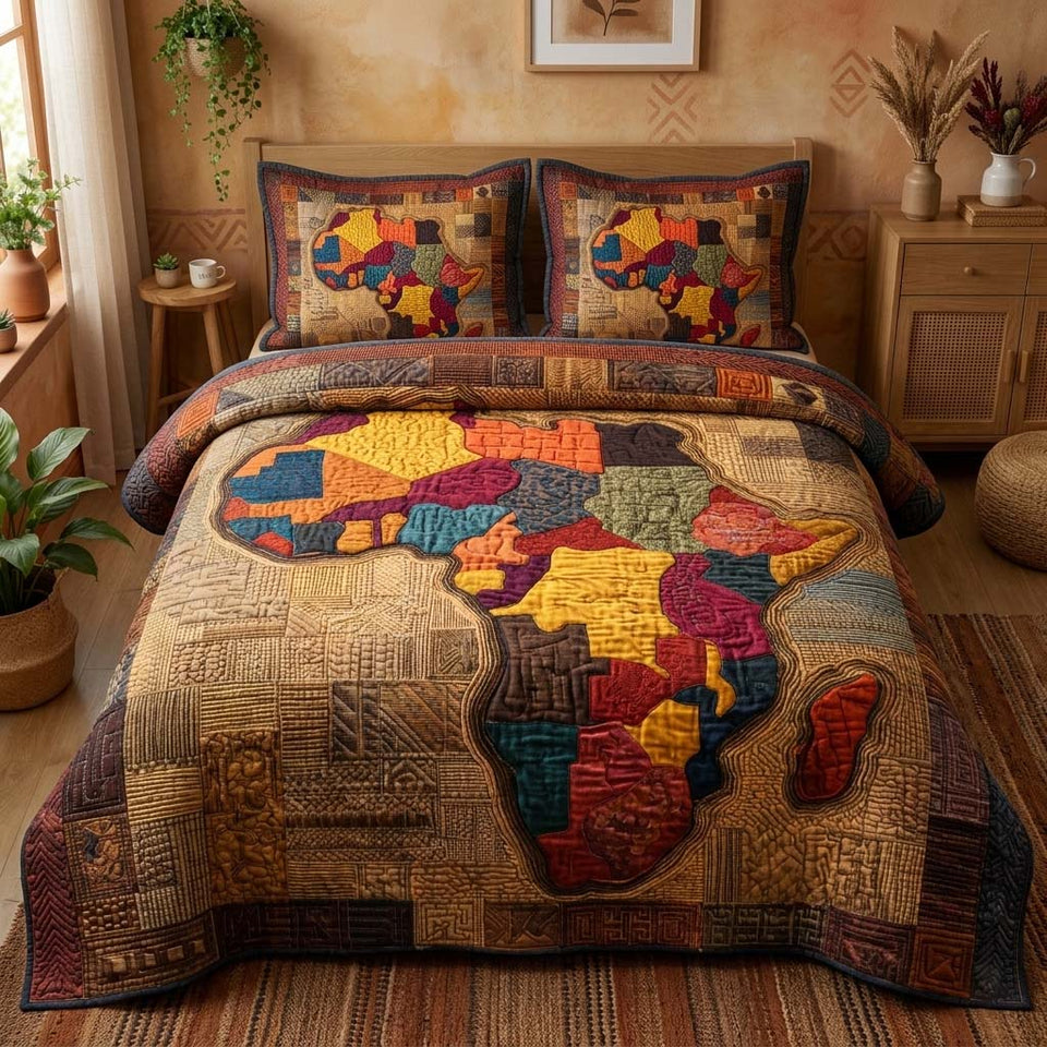 Patchwork Africa quilted bedding set, quilt and two pillow shams on a made bed