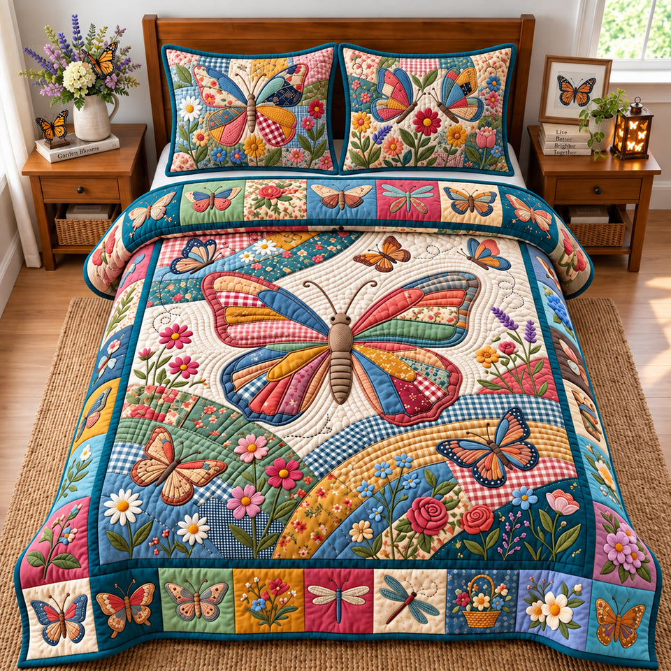 Patchwork Butterfly Be The Good quilted bedding set, quilt and two pillow shams on a made bed