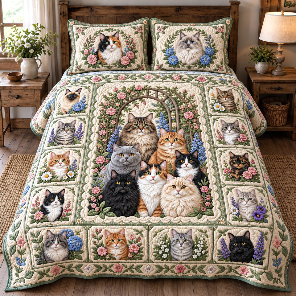 Patchwork Floral Cats quilted bedding set, quilt and two pillow shams on a made bed
