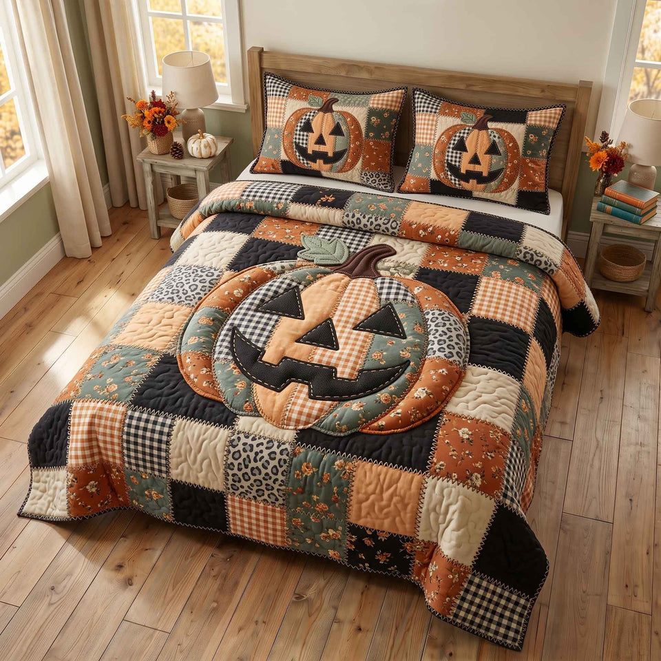 Patchwork Pumpkin Patch in Charcoal quilted bedding set, quilt and two pillow shams on a made bed