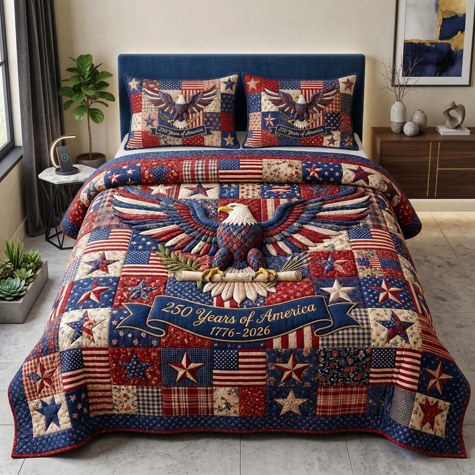 Patriot Eagle Star Patch Anniversary quilted bedding set, quilt and two pillow shams on a made bed