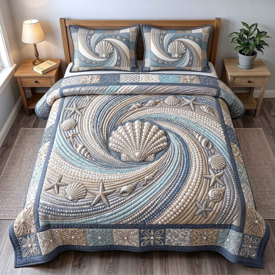 Pearl Shell Swirl quilted bedding set, quilt and two pillow shams on a made bed
