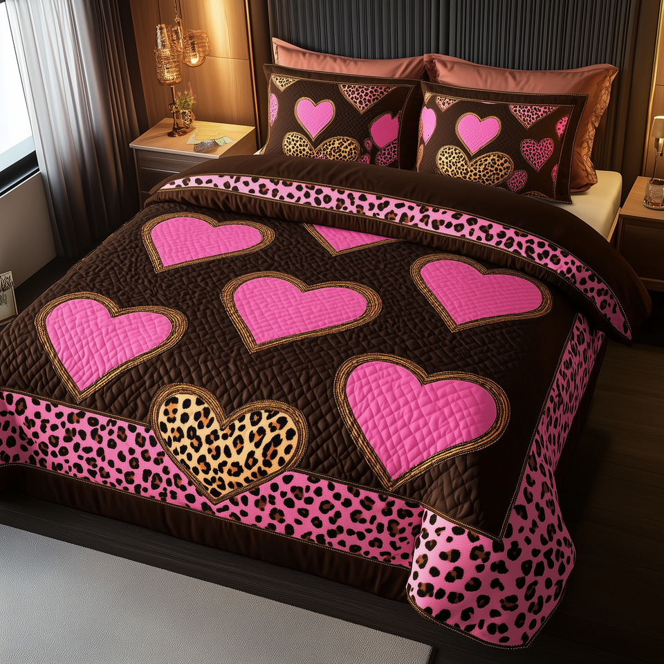 Pink Leopard Heart Polka Dot Trim quilted bedding set, quilt and two pillow shams on a made bed