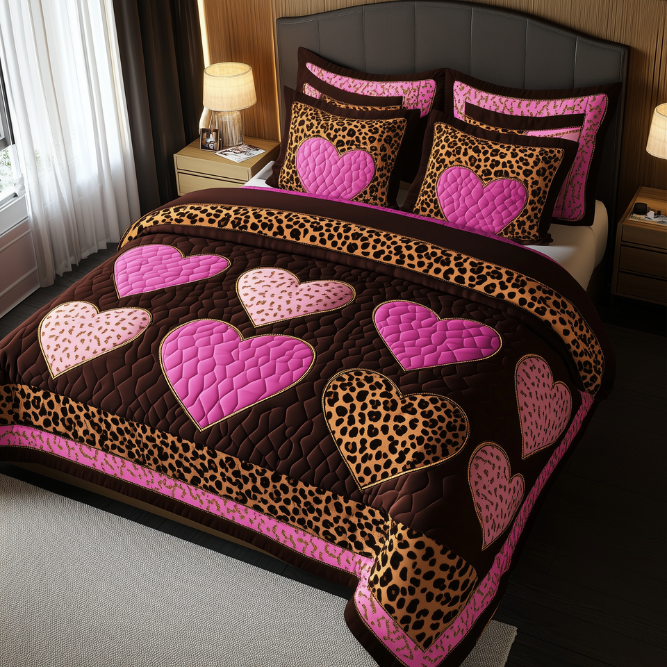 Pink Leopard Heart Spotted Border Band quilted bedding set, quilt and two pillow shams on a made bed