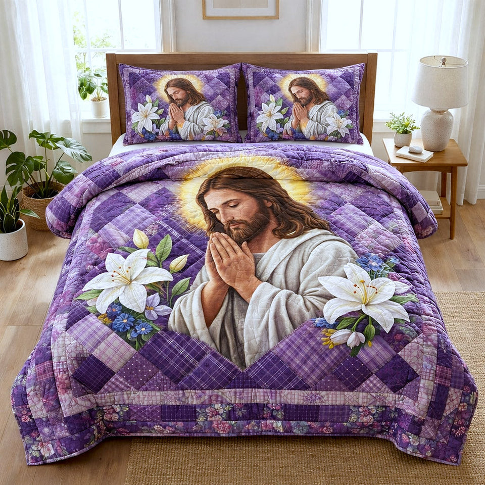 Praying Jesus Lilies quilted bedding set, quilt and two pillow shams on a made bed