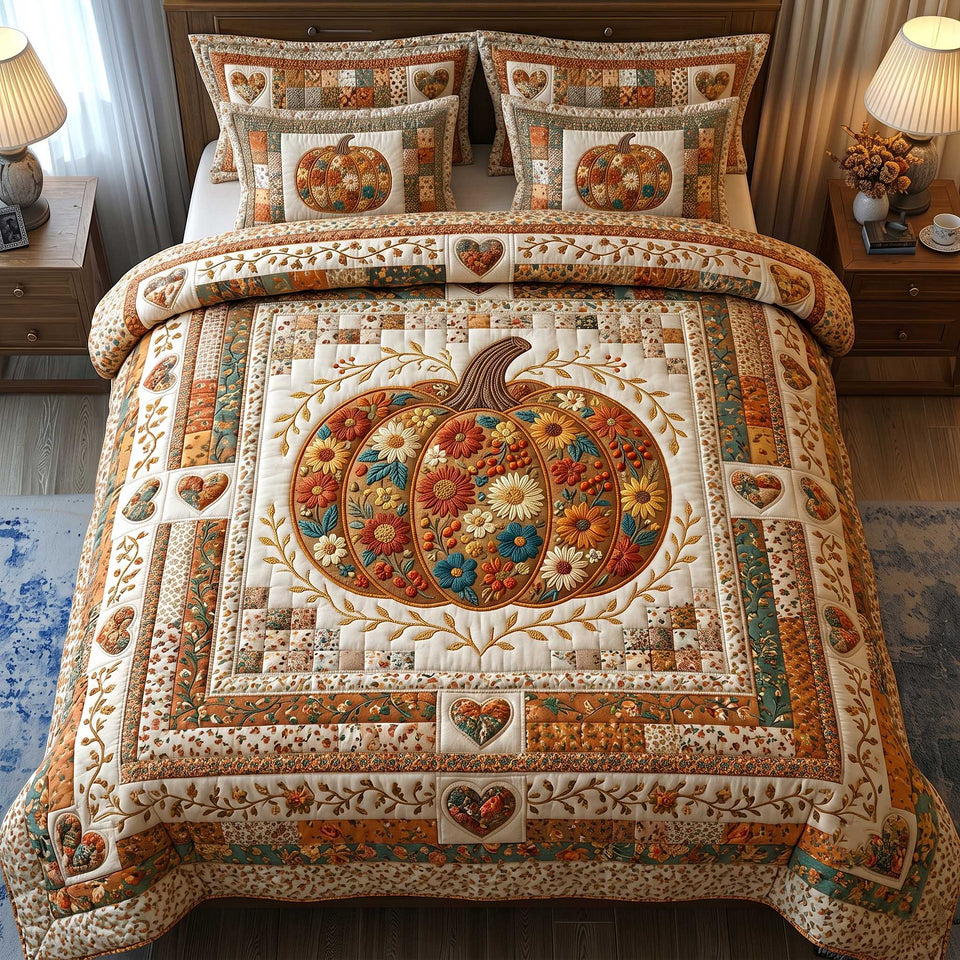 Pumpkin Blossom Harvest quilted bedding set, quilt and two pillow shams on a made bed