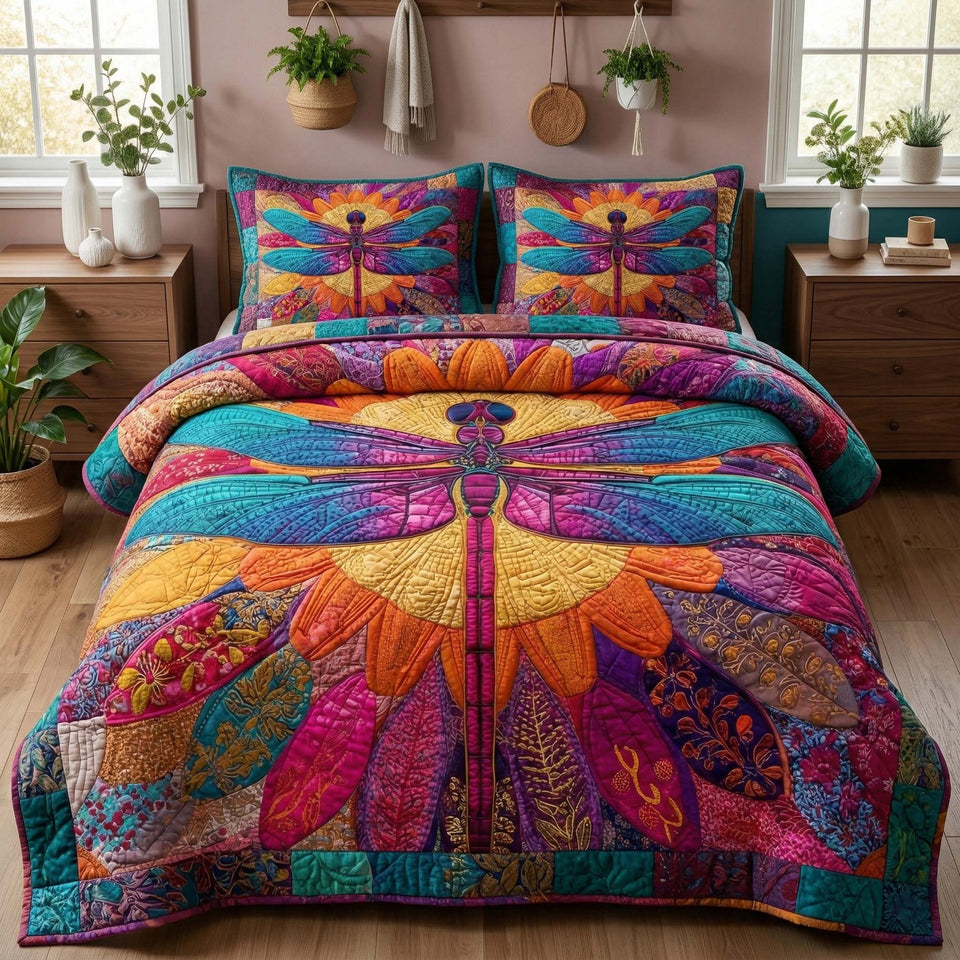 Radiant Dragonfly Mosaic Glow quilted bedding set, quilt and two pillow shams on a made bed