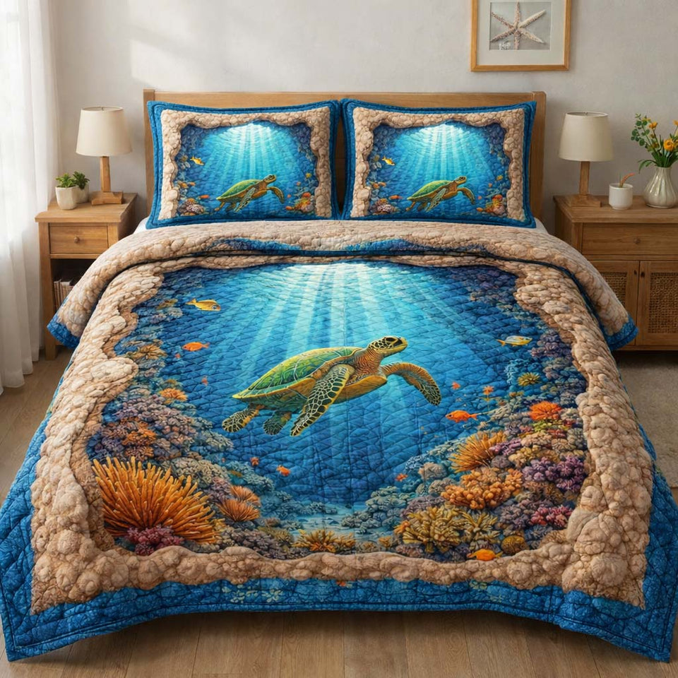 Reef Turtle quilted bedding set, quilt and two pillow shams on a made bed