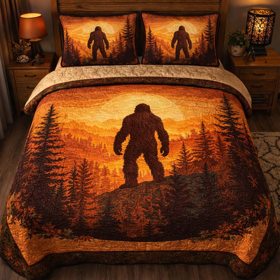 Rustic Trail Bigfoot quilted bedding set, quilt and two pillow shams on a made bed
