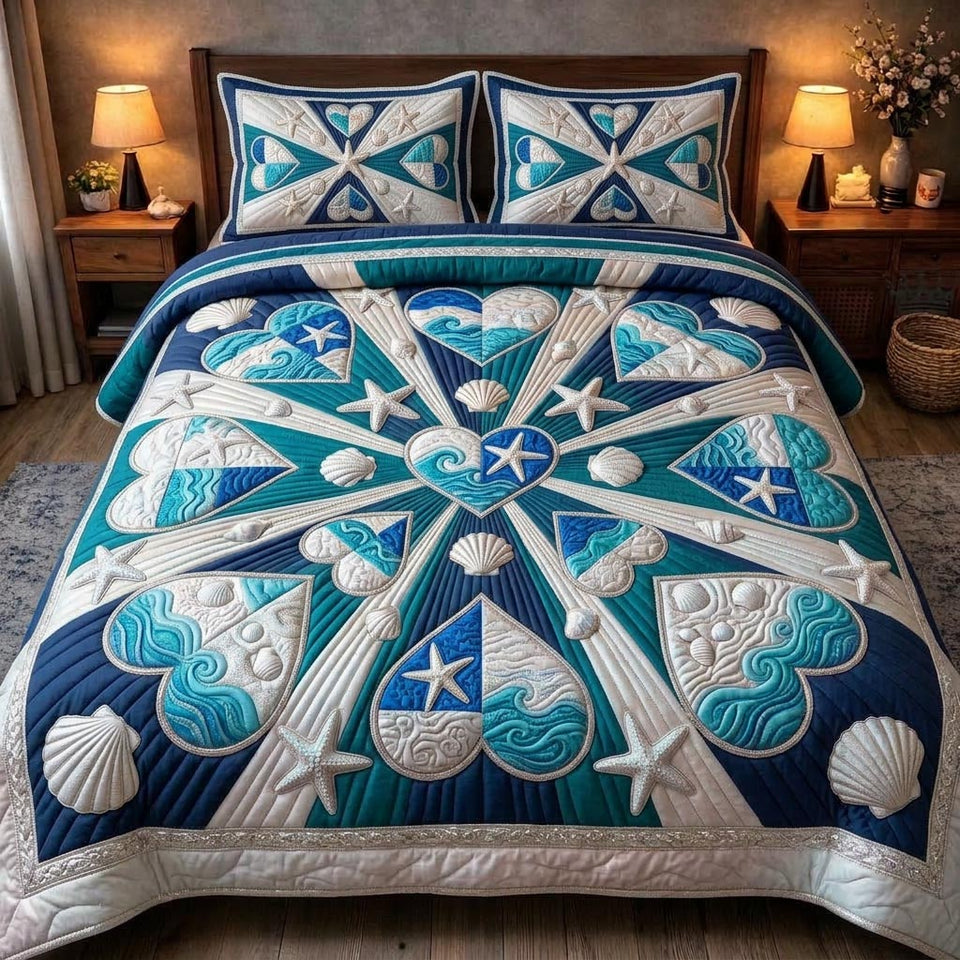 Sea Shells Navy Starburst Mandala quilted bedding set, quilt and two pillow shams on a made bed