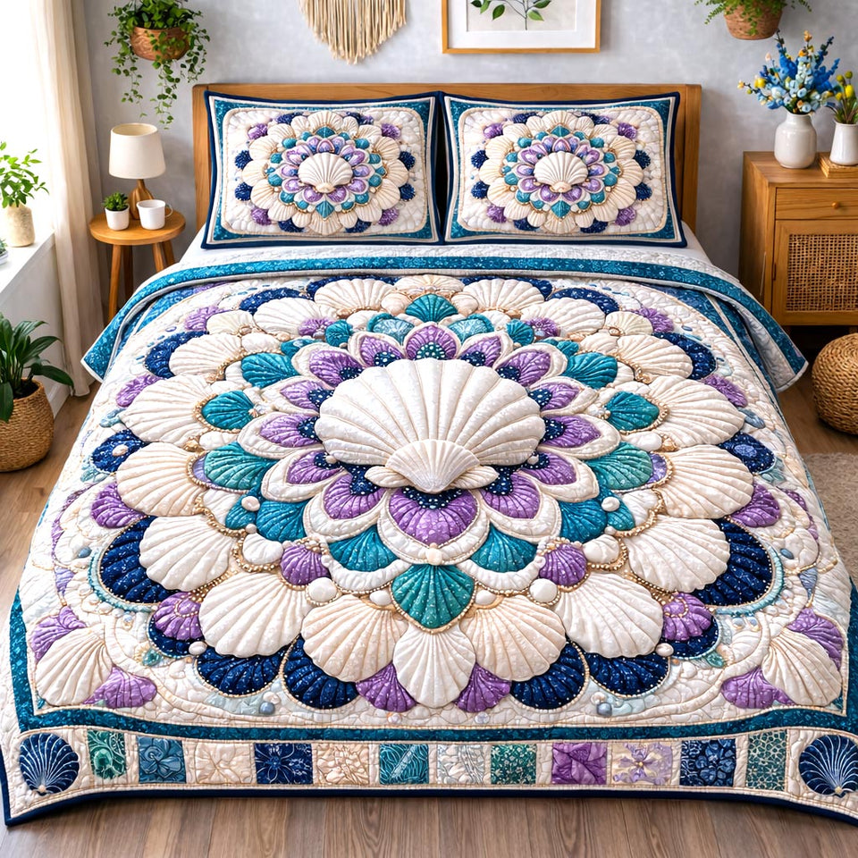 Seashell Fan Mandala quilted bedding set, quilt and two pillow shams on a made bed