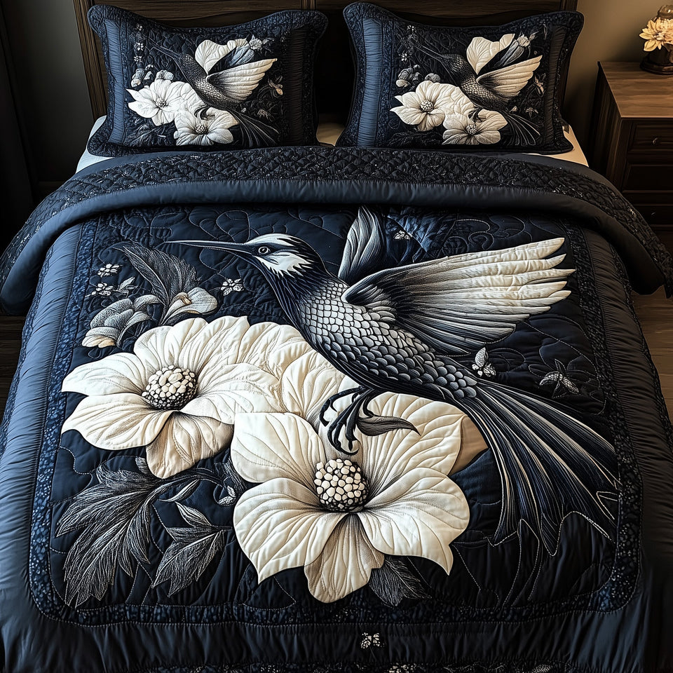 Shadowlight Hummingbird White Hibiscus Navy quilted bedding set, quilt and two pillow shams on a made bed