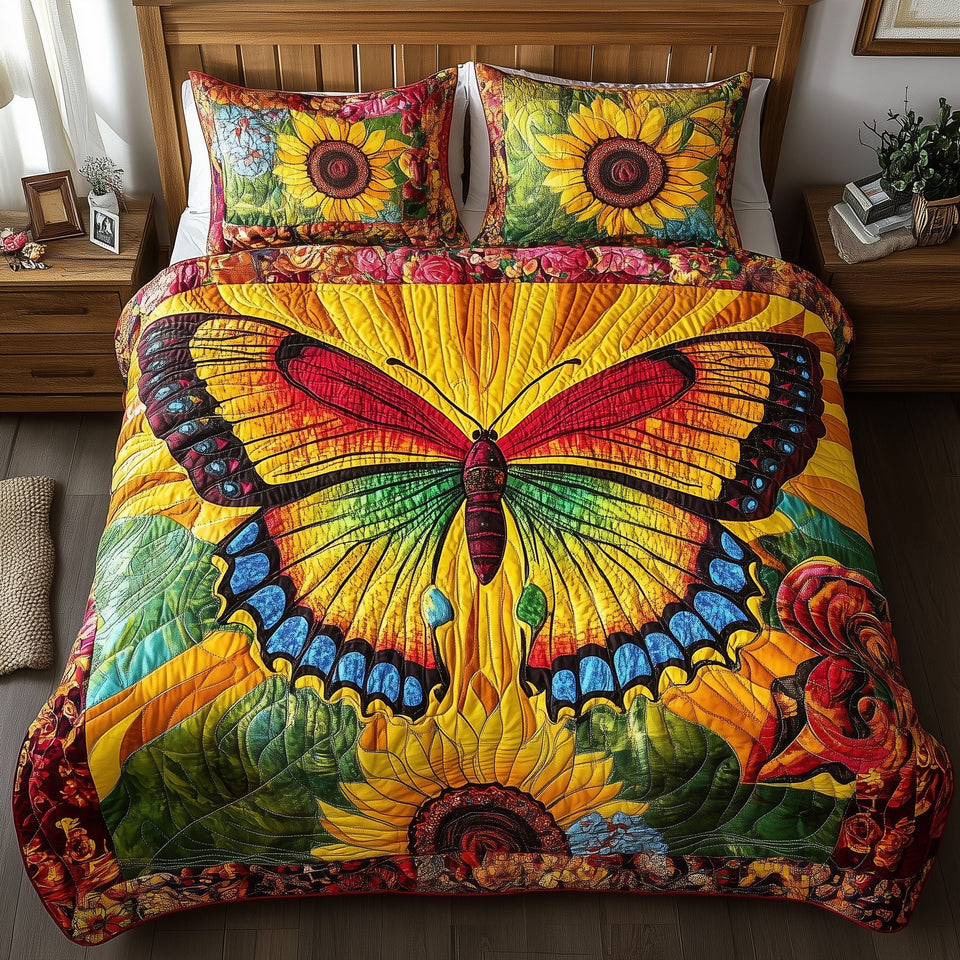 Shining Butterfly Sapphire Tips Wide Bloom quilted bedding set, quilt and two pillow shams on a made bed
