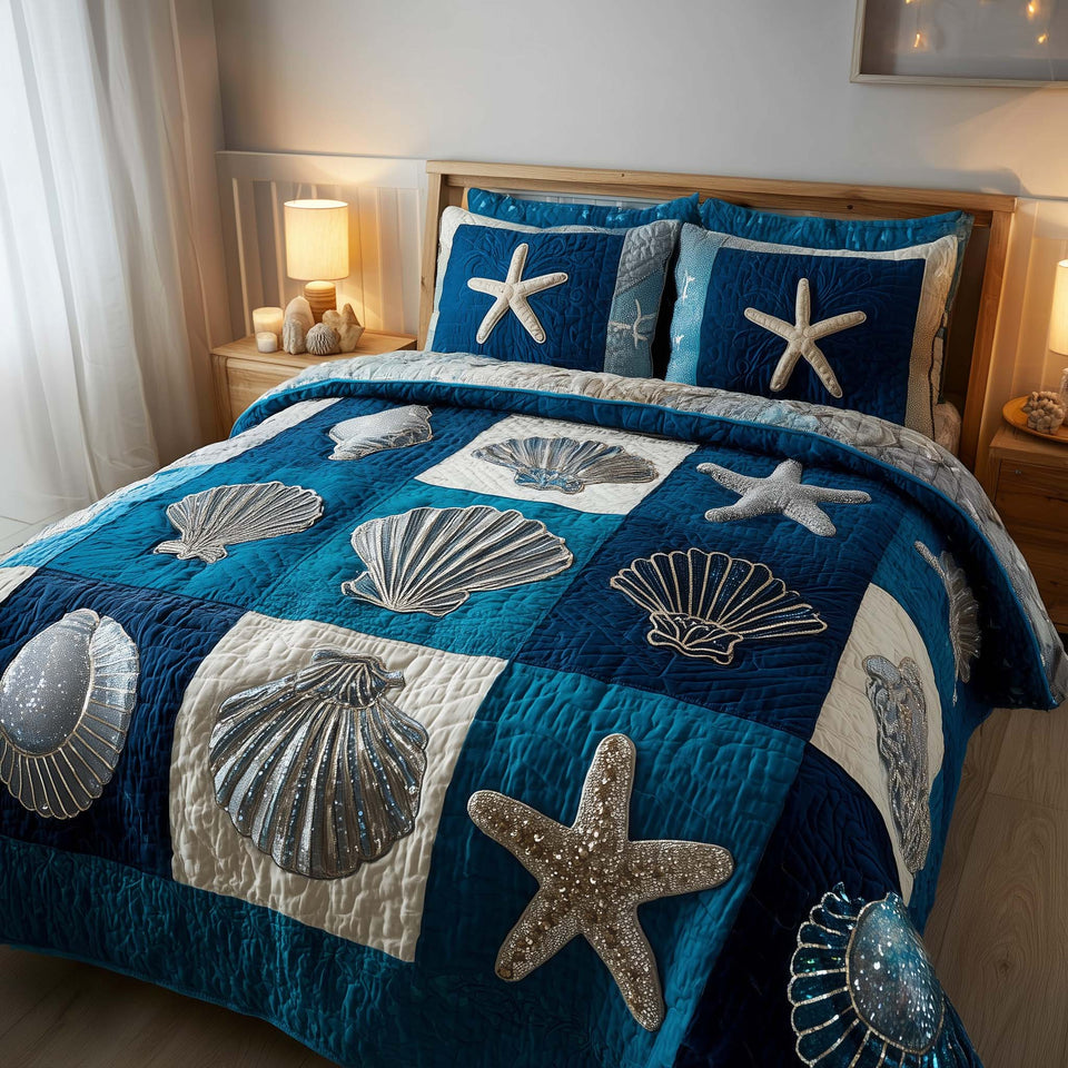 Shoreline Gems Teal and Navy Shell Blocks quilted bedding set, quilt and two pillow shams on a made bed