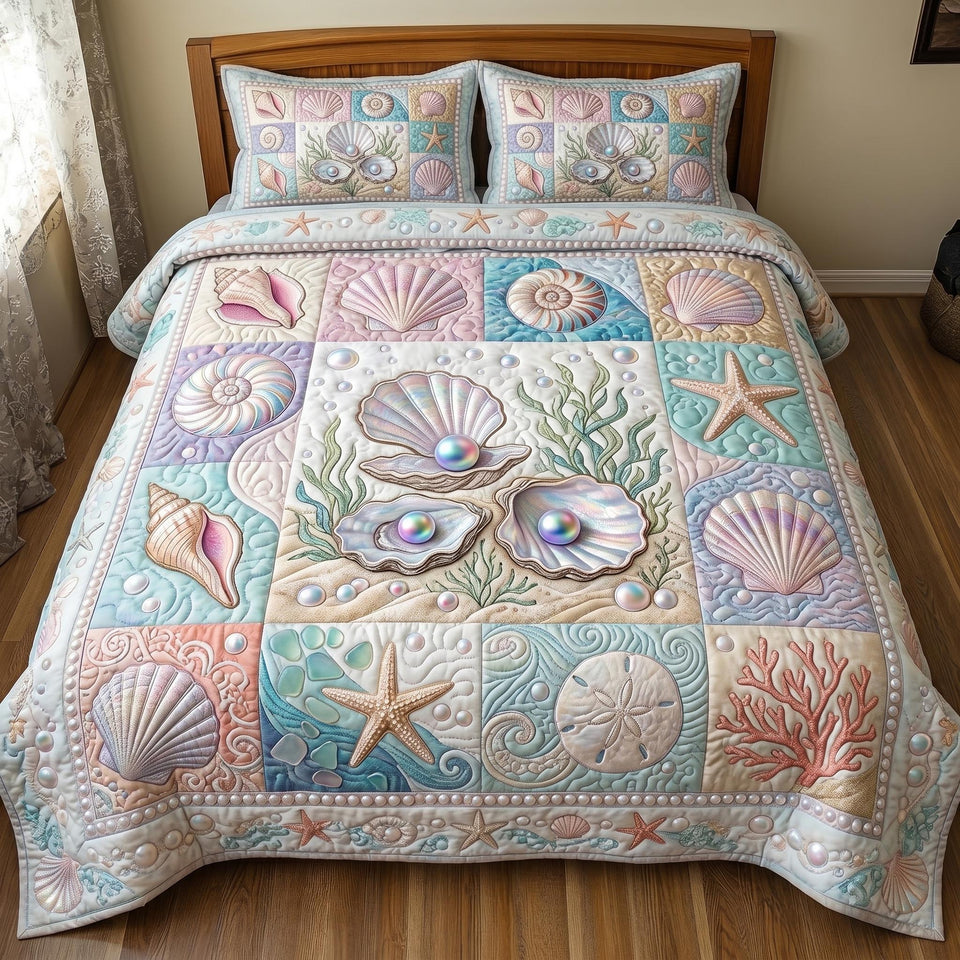 Shoreline Shell Tiles quilted bedding set, quilt and two pillow shams on a made bed
