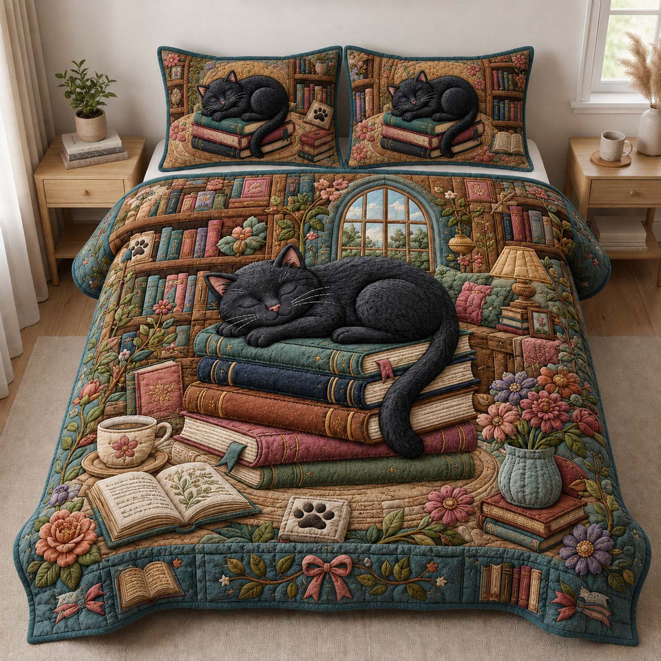 Sleeping Book Stack Cat quilted bedding set, quilt and two pillow shams on a made bed