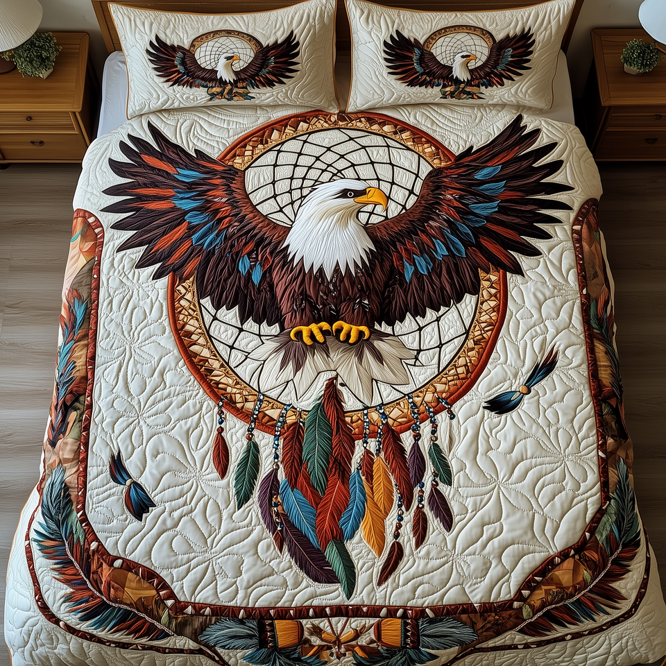 Soaring Eagle Dreamcatcher quilted bedding set, quilt and two pillow shams on a made bed