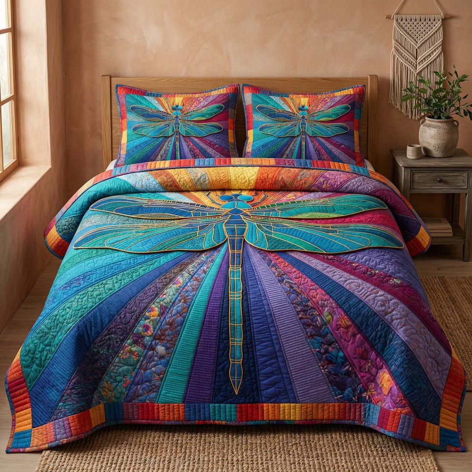 Spectrum Dragonfly quilted bedding set, quilt and two pillow shams on a made bed