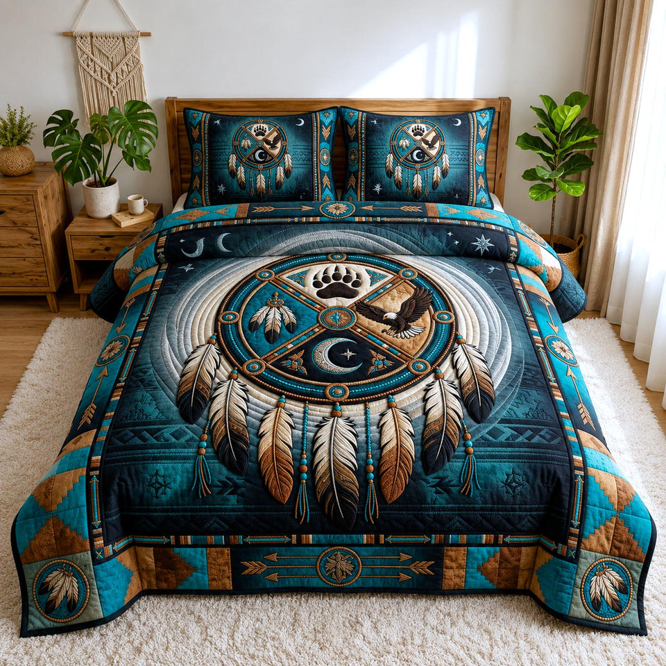 Spirit Dreams quilted bedding set, quilt and two pillow shams on a made bed