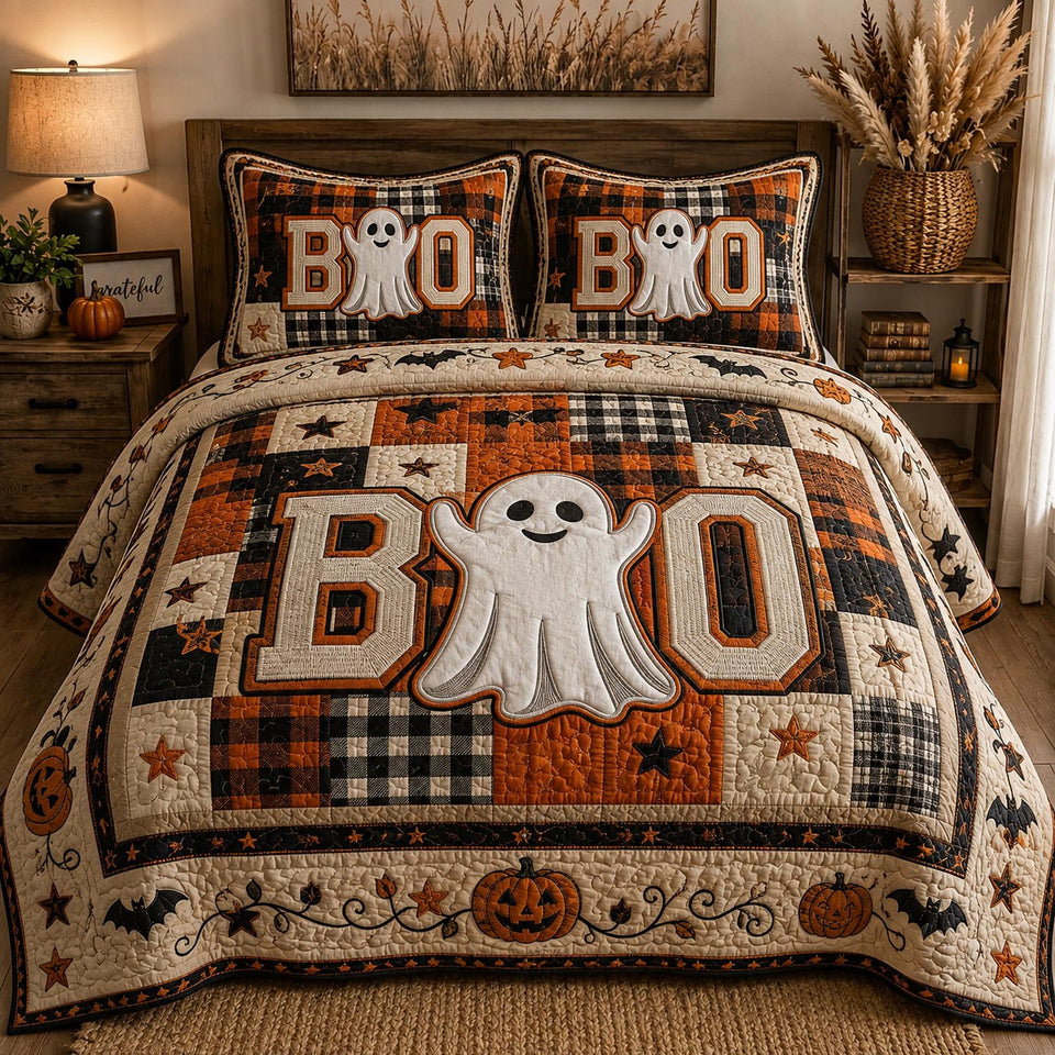 Spooky Patchwork quilted bedding set, quilt and two pillow shams on a made bed