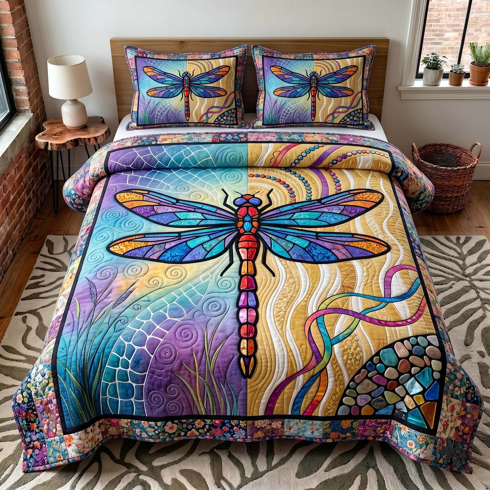 Stained Glass Dragonfly 95 quilted bedding set, quilt and two pillow shams on a made bed