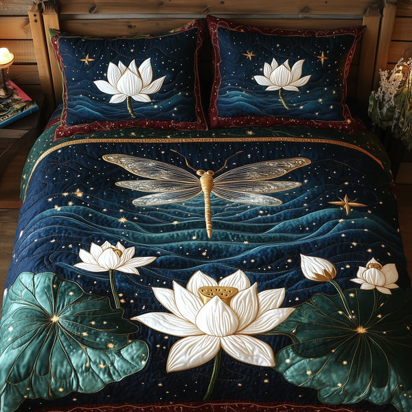 Starlit Lotus Skimmer quilted bedding set, quilt and two pillow shams on a made bed