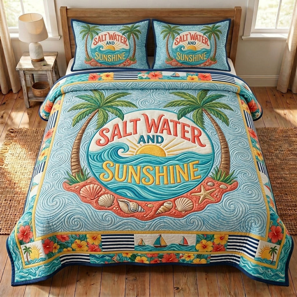 Summer Escape Salt Water Sunshine Oval quilted bedding set, quilt and two pillow shams on a made bed