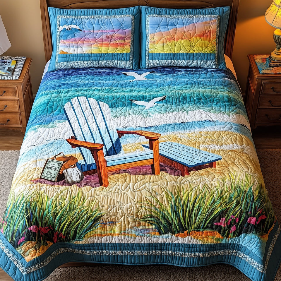 Summer Is Calling Chair and Books in the Dunes quilted bedding set, quilt and two pillow shams on a made bed