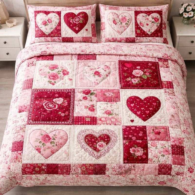 Sweetheart Rose Squares quilted bedding set, quilt and two pillow shams on a made bed