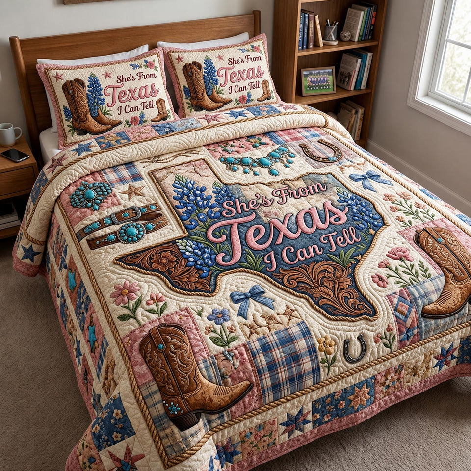 Texas Bluebonnet Boots quilted bedding set, quilt and two pillow shams on a made bed