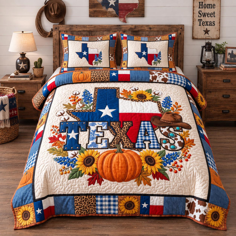 Texas Fall Pumpkin quilted bedding set, quilt and two pillow shams on a made bed