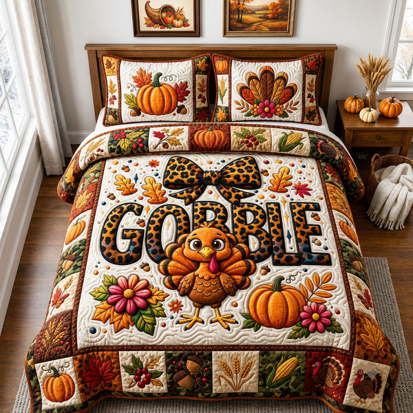 Thanksgiving Gobble quilted bedding set, quilt and two pillow shams on a made bed