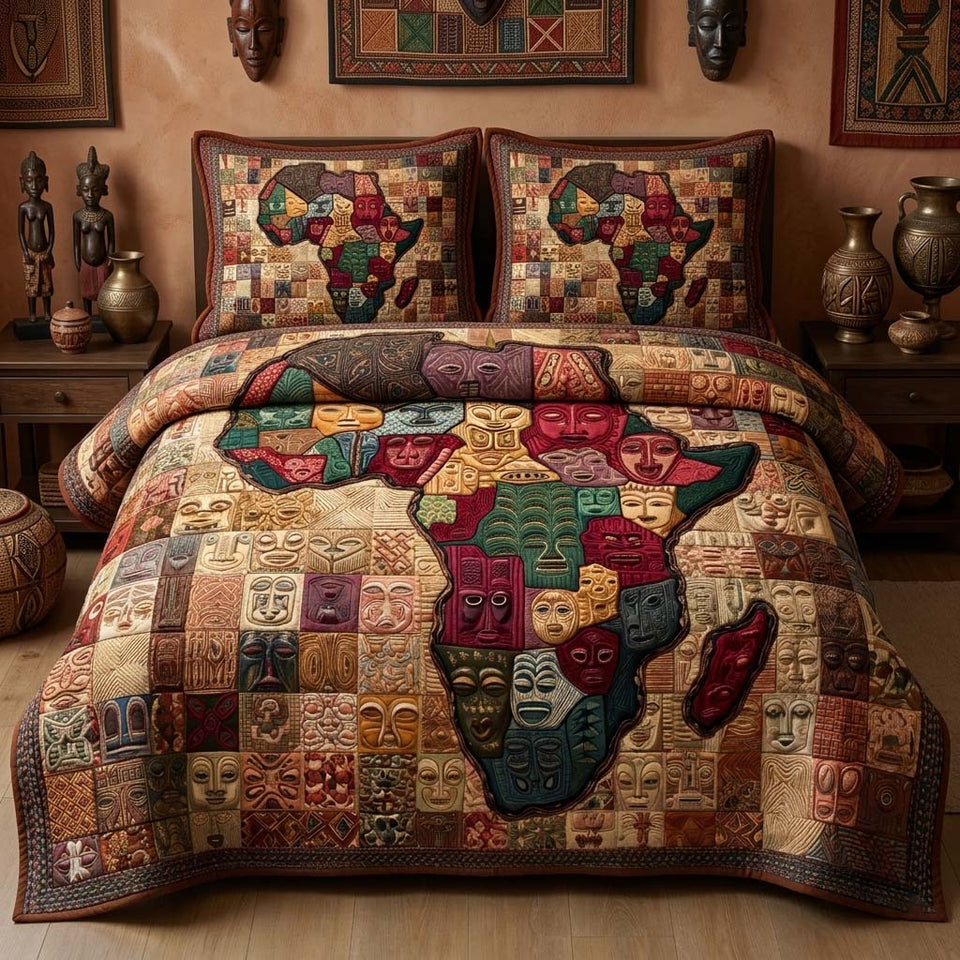 Tribal Mosaic quilted bedding set, quilt and two pillow shams on a made bed