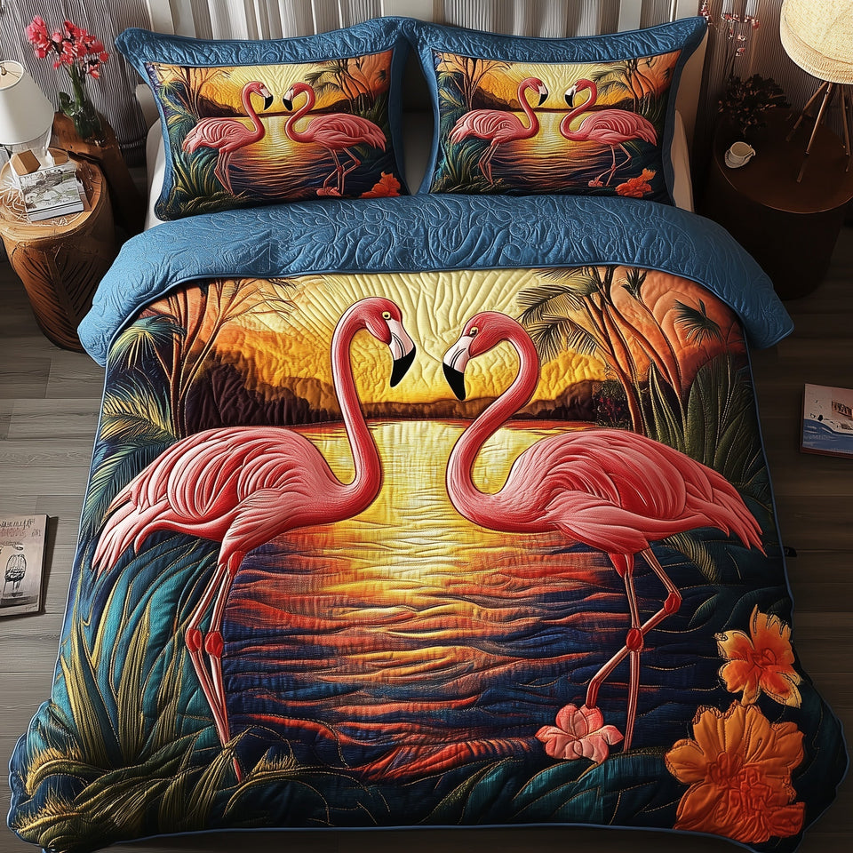 Tropical Sunset Flamingo quilted bedding set, quilt and two pillow shams on a made bed