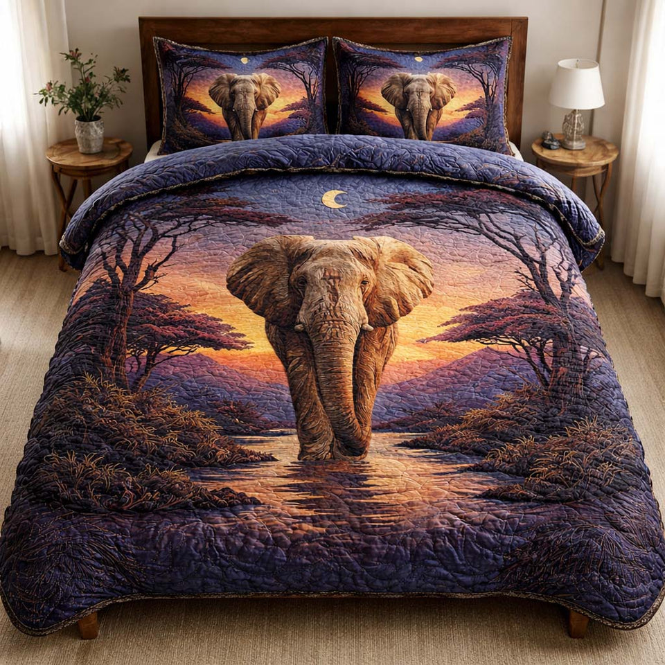 Twilight Elephant quilted bedding set, quilt and two pillow shams on a made bed