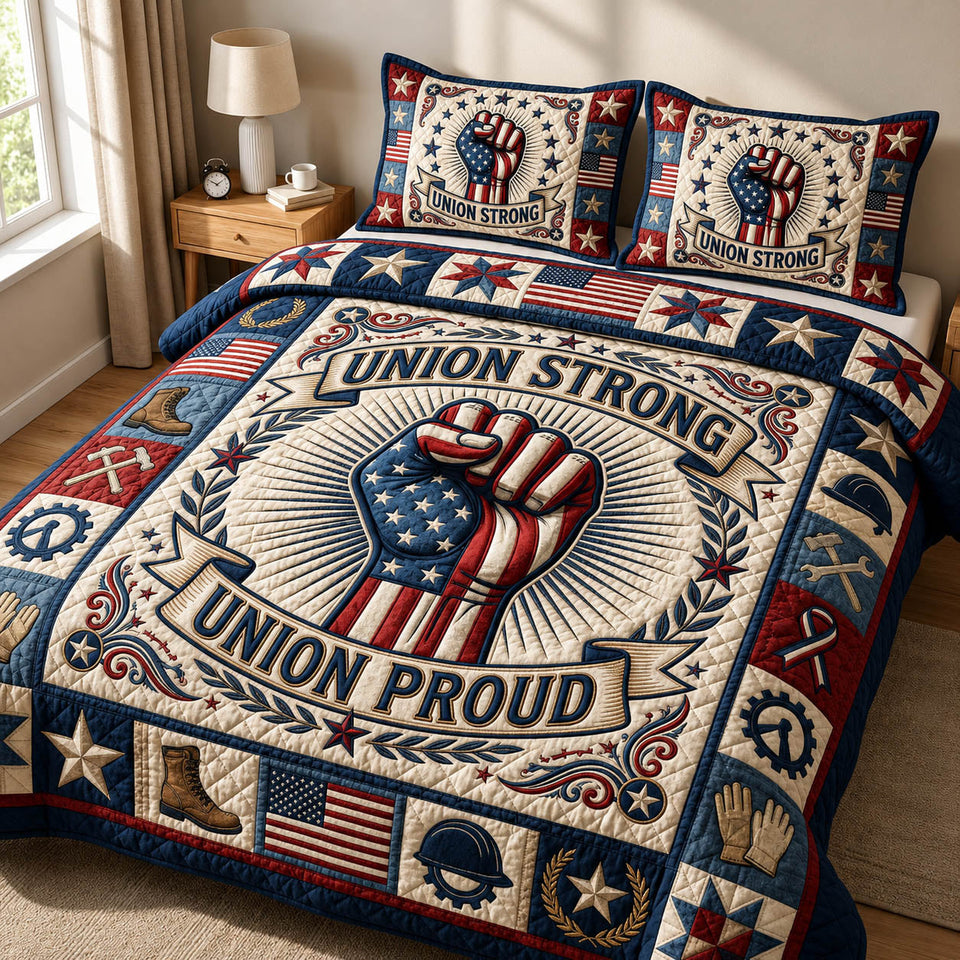 Union Strong Fist Banner quilted bedding set, quilt and two pillow shams on a made bed