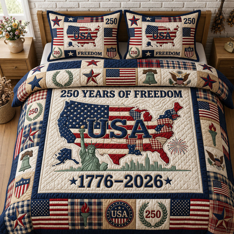 USA Map Freedom Anniversary quilted bedding set, quilt and two pillow shams on a made bed