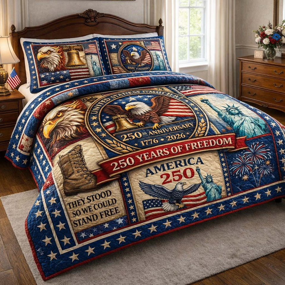 Valor 250 Freedom Tribute quilted bedding set, quilt and two pillow shams on a made bed