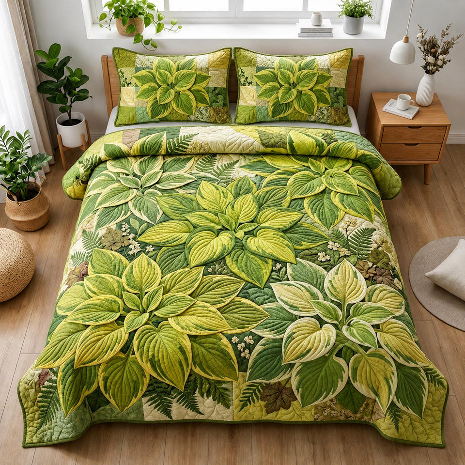 Verdant Leaf Canopy quilted bedding set, quilt and two pillow shams on a made bed