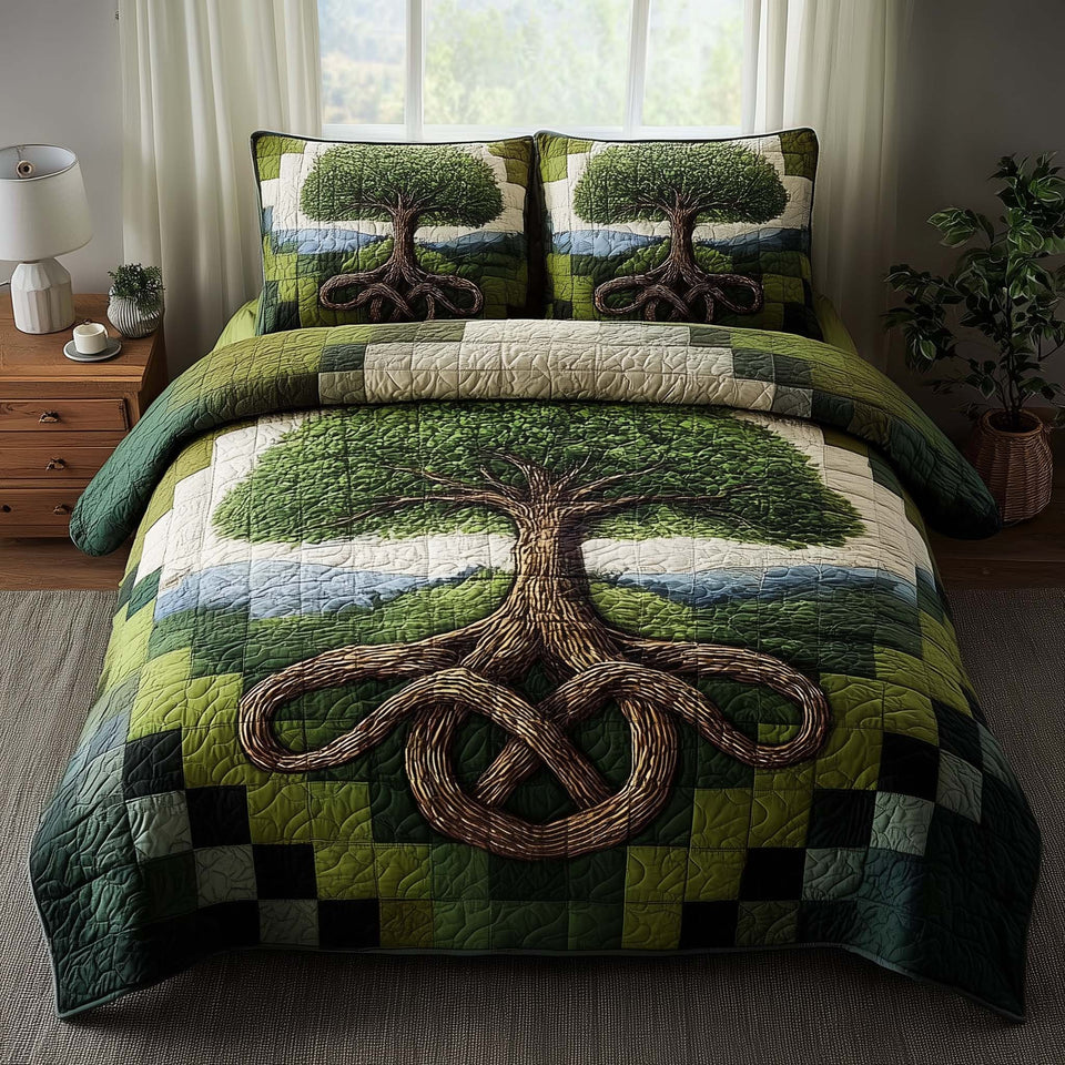 Verdant Tree Of Life quilted bedding set, quilt and two pillow shams on a made bed