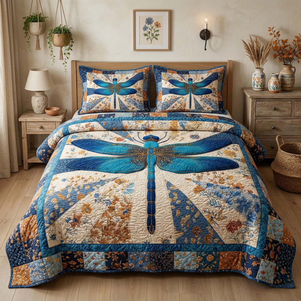 Vintage Dragonfly Calico Sky quilted bedding set, quilt and two pillow shams on a made bed