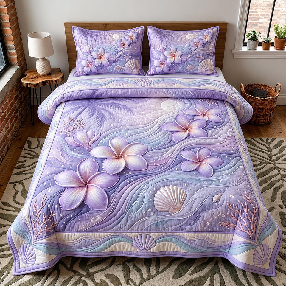 Violet Plumeria Breeze quilted bedding set, quilt and two pillow shams on a made bed