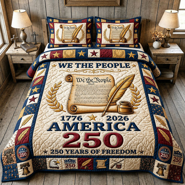 We the People Scroll and Quill quilted bedding set, quilt and two pillow shams on a made bed