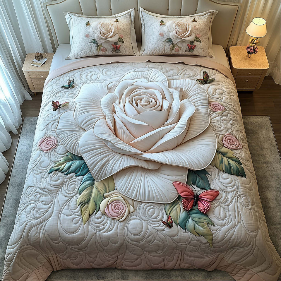 White Rose quilted bedding set, quilt and two pillow shams on a made bed